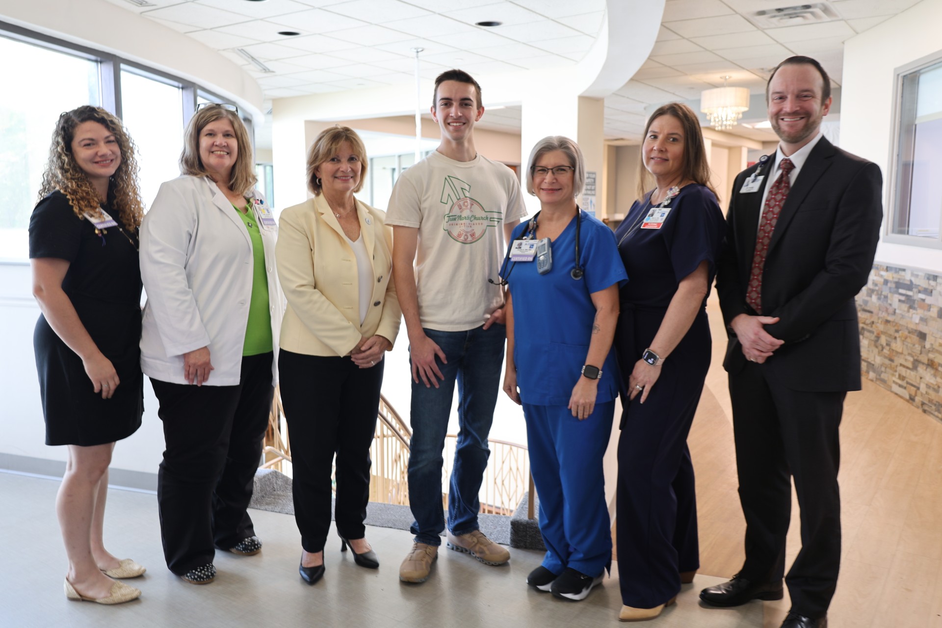 (From left to right) Mikaela Minnear BSN, RN, C-EFM, Perinatal Educator,  Teresa Lilly, RNC, Director of Women’s LifeCare Center,  Mary Driscoll, Vice Chancellor for University Advancement James Saxon, scholarship recipient  Jennifer Redd, BSN, RNC, Nursery, Dawn Shepeard, RN, Perinatal Nurse Manager,  Matthew Merrifield, Chief Operation Officer,