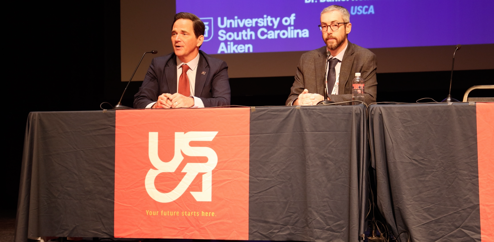 USCA Chancellor Dr. Daniel Heimmermann (left) and Matt Griffin, head of nuclear affairs (right), sign the Antares partnership agreement.