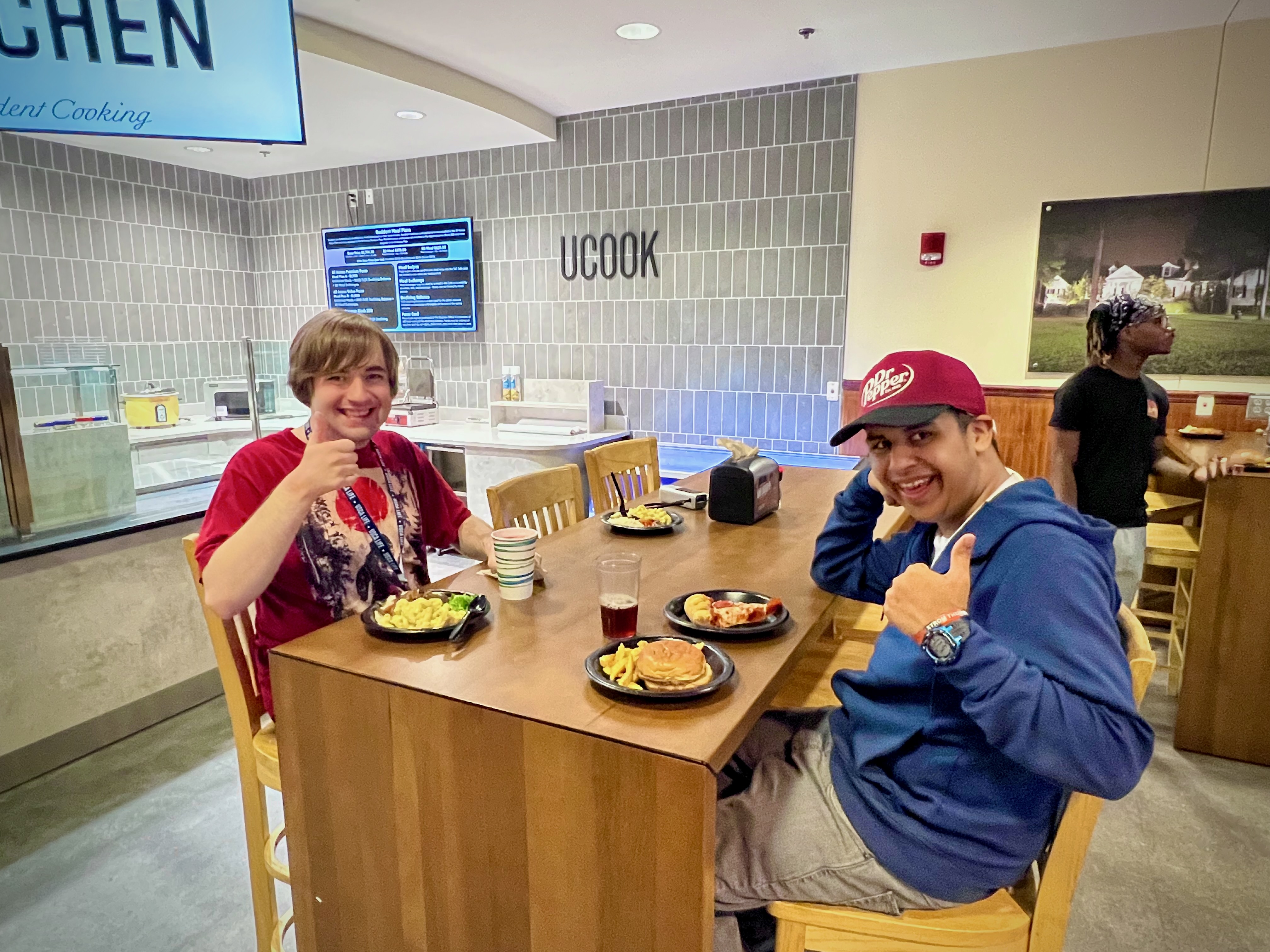 Two LIFE students having dinner at the SAC Café on campus.